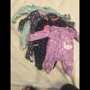 Assortment of newborn girl sleepers
